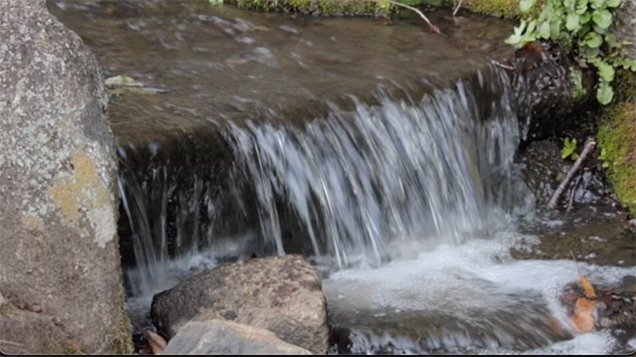 Gutter water flowing like waterfall