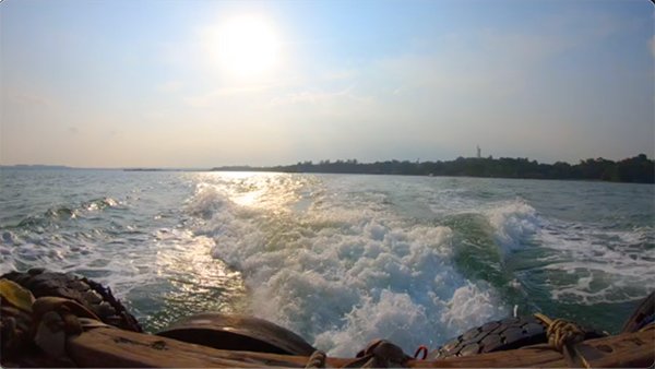 a boat leaving an island