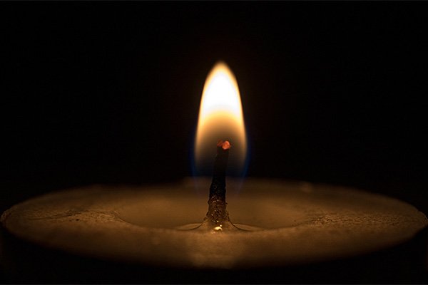 a closeup of a burning candle