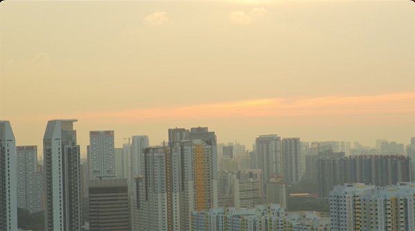 sunset behind the tall sky scrapers in Singapore