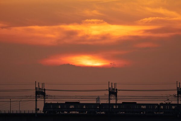 sunset view with a train passing by